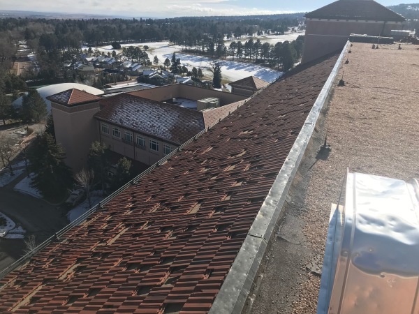 Close-up of hail damage on roofing material